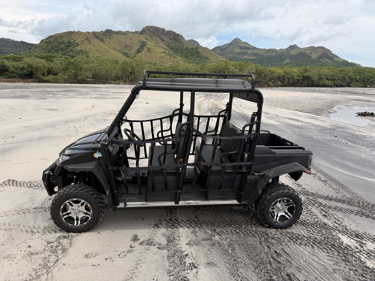 Trek UTV - dos filas de asientos y cama volcable, en la playa